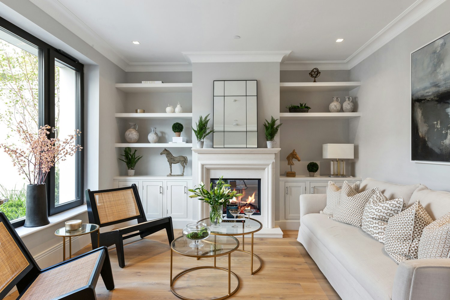 A lived-in living room arranged around a fireplace