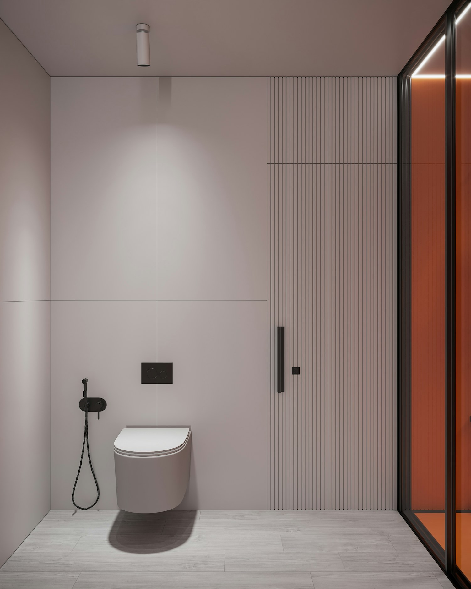 A bathroom with a toilet and shower enclosure