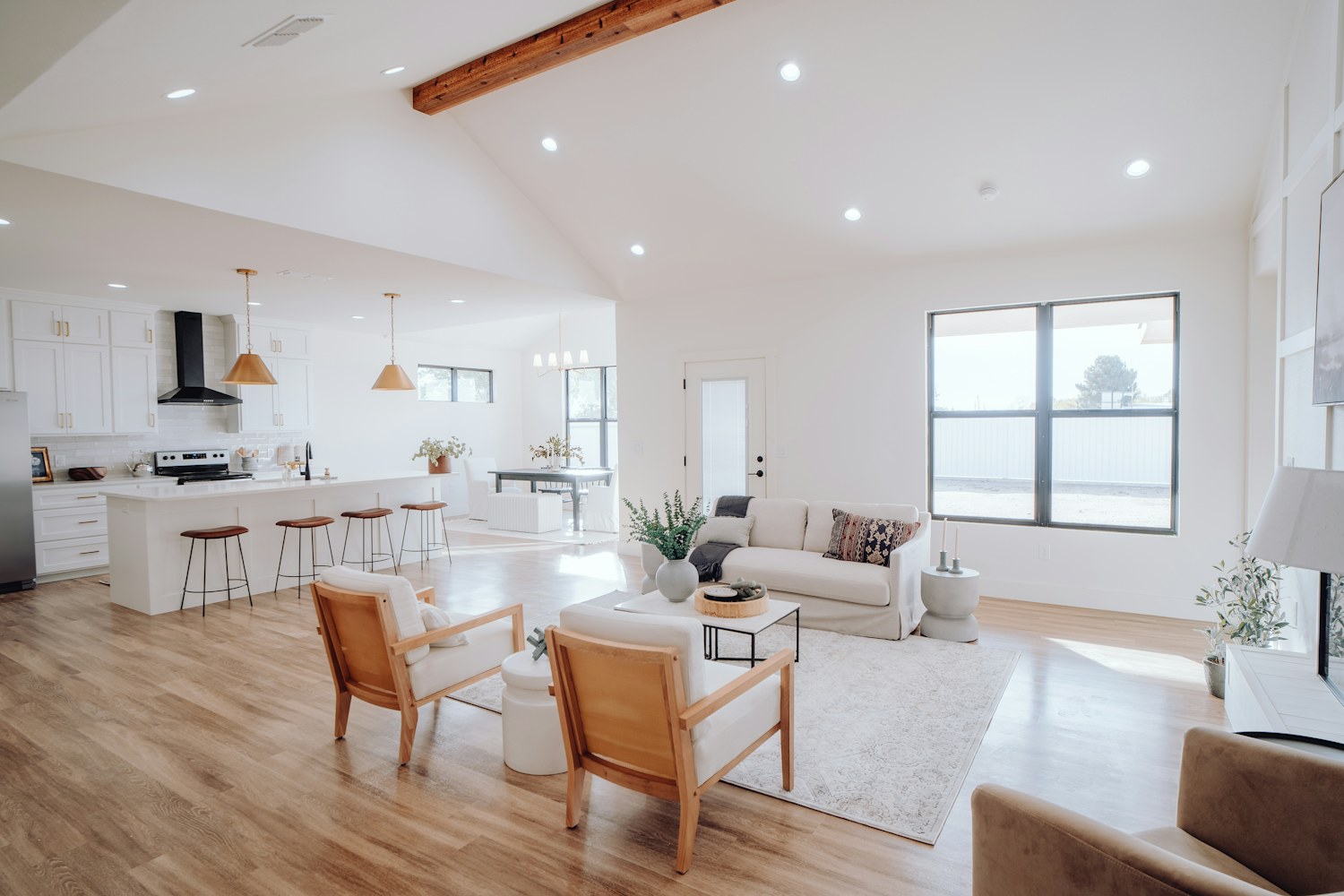 An open kitchen and living room with a central island