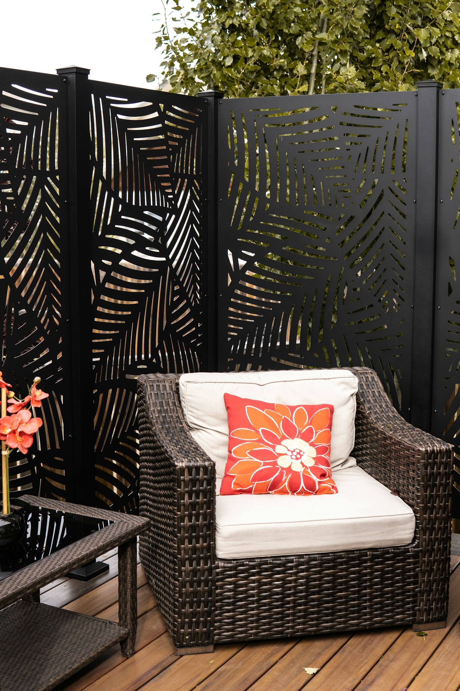 A simple chair and table on a wooden outdoor deck